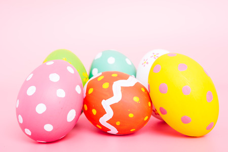 Beautiful Easter group egg multi color on pink background, Easter day conceptの写真素材