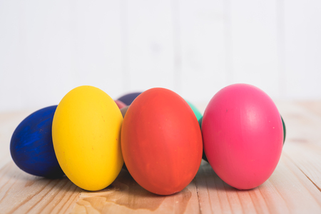 Easter eggs clean on wooden and white background, easter day conceptの写真素材