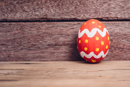 Beautiful Easter egg on wooden background, Easter day conceptの写真素材
