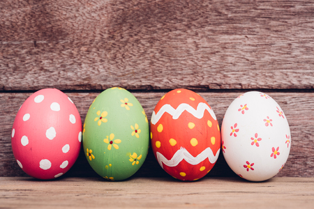 Beautiful Easter egg on wooden background, Easter day conceptの写真素材