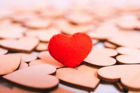 Red hearts stand on pink background with copy space, valentine day conceptの写真素材