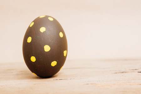 Beautiful Easter Brown egg on wooden background, Easter day conceptの写真素材