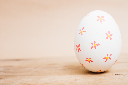 Beautiful Easter White egg on wooden background, Easter day conceptの写真素材