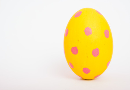 Beautiful Easter Yellow egg color isolate on white background, Easter day conceptの写真素材