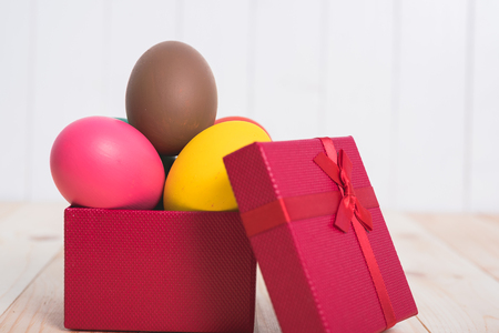 Easter eggs clean in red box gift on wooden background, easter day conceptの写真素材
