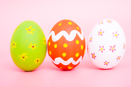 Beautiful Easter group egg multi color on pink background, Easter day conceptの写真素材