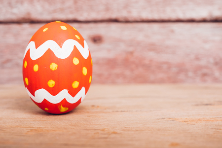 Beautiful Easter Red egg on wooden background, Easter day conceptの写真素材