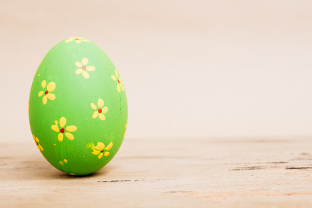 Beautiful Easter Green egg on wooden background, Easter day conceptの写真素材