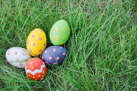 Beautiful Easter Multi color egg on garden, Easter day conceptの写真素材