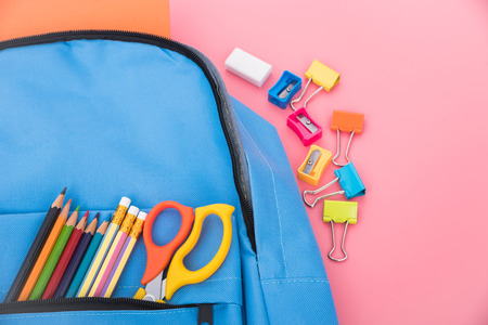 Blue bag backpack for education children on pink background back to school conceptの写真素材