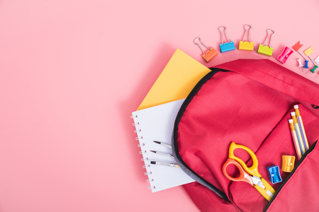 Top view Red bag backpack for education children on pink background back to school conceptの写真素材