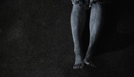 Woman ghost horror sitting near wall in the house, halloween conceptの写真素材