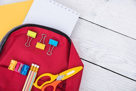 Top view Red bag backpack for education children on white wooden  background back to school conceptの写真素材
