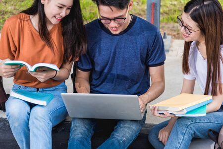 Male students are opening laptop computers to discuss, Education concept