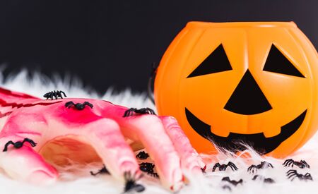 Pumpkin Jack orange color and have blood on hand this horror in Halloween day on black backgroundの写真素材