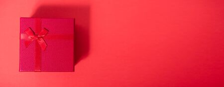 Top view close up Red gift box on red background and have long copy space for useの写真素材
