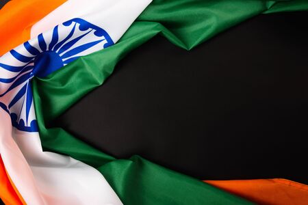 Indian republic day, flat lay top view, Indian flag on black background with copy space for your...