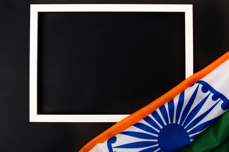 Indian republic day, flat lay top view, Indian flag and photo frame on black background with copy space for your textの写真素材