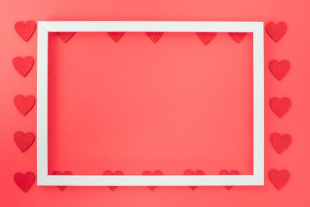 Valentine's Day background, Top view Flat lay Red heart round photo frame on red background. Valentines day concept with copy spaceの写真素材