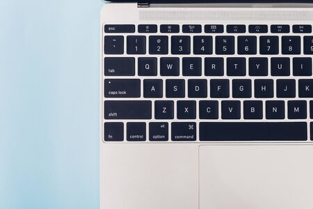 Top view laptop computer notebook isolated on blue background