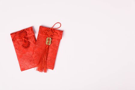 Chinese new year festival concept, flat lay top view, Happy Chinese new year with Red envelope (Character "FU" means fortune, blessing) on white background with copy space for textの写真素材