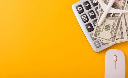 April of the year is Tax Day, Top view flat lay closeup calculator and Dollar money, on yellow background business finance budget concept with copy space for textの写真素材