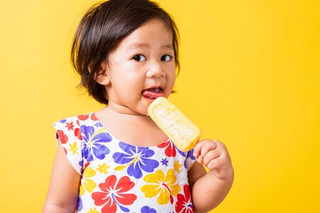 Happy portrait Asian baby or kid cute little girl attractive laugh smile wearing dick pattern shirt...