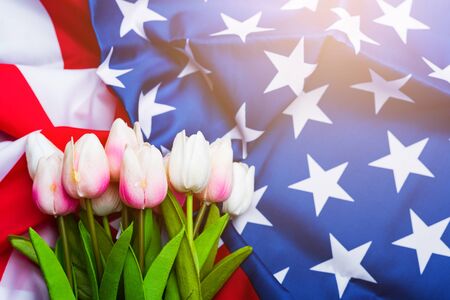 Happy Memorial Day Remember previously but now seldom called Decoration Day, American flag and a Tulip flower on a black background and copy space, a federal holiday in the United Statesの写真素材