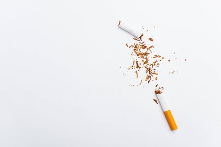 31 May of World No Tobacco Day, no smoking, close up of broken pile cigarette or tobacco STOP symbolic on white background with copy space, and Warning lung health conceptの写真素材