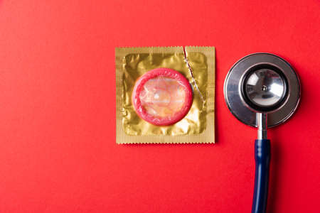 World sexual health or Aids day, Top view flat lay medical equipment, condom in pack and...