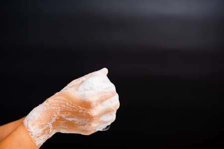 Closeup body care Asian young woman washing hands with soap have foam, hygiene prevention COVID-19...