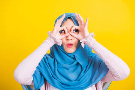 Asian Muslim Arab, Portrait of happy beautiful young woman Islam religious wear veil hijab funny...