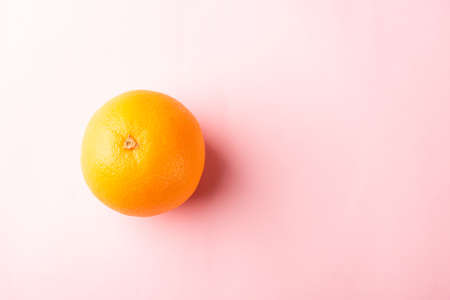 Top view of Fresh full orange fruit in the studio shot isolated on pink background, Healthy food...