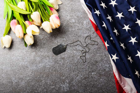 America United States flag and tulip flower, memorial remembrance and thank you of hero, studio shot...