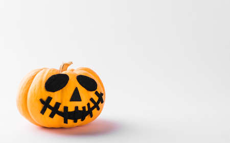 Funny Halloween day party concept ghost pumpkin head jack lantern scary smile, studio shot isolated on white background, Holiday decorationの写真素材