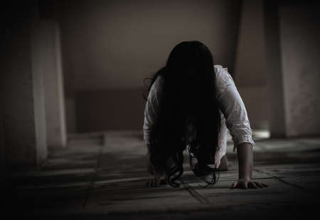 Female zombie in blood. Asian Woman ghost with blood. Horror scary fear in dark house creepy...