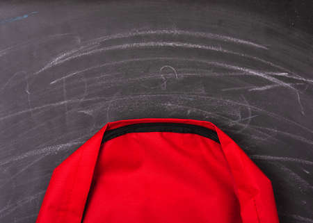 Back to school shopping pocket backpack on the education red bag on blackboard and chalkboardの写真素材