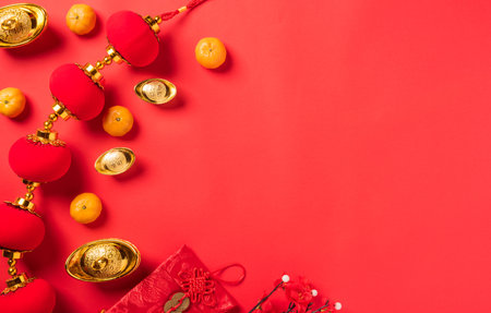 Chinese new year 2021 festival, Flat lay top view lunar new year or Happy Chinese new year celebration decorations with copy space on red background (Chinese character "fu" meaning fortune good luck)の写真素材