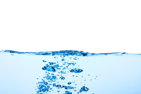Light blue water wave with air bubbles and a little bit splashed underwater, studio shot isolated on...