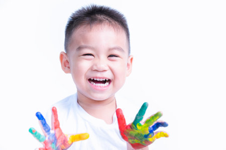 Happy asian child kid smile on education art show hand with water color or finger paint on hands the photogarphy in studio on with background, Baby 2-3 yearsの写真素材