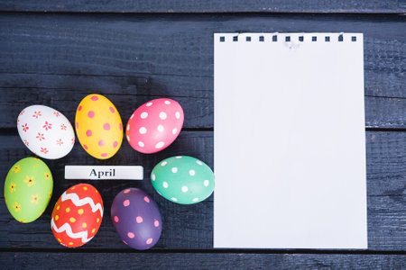 Easter eggs top view on black wooden background have white paper and copy space for useの写真素材