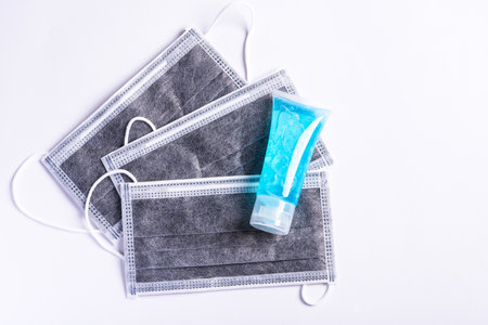Medical carbon protective face mask for cover mouth and nose and alcohol gel sanitizer hand gel cleaners isolated on white background, Safety healthcare medical prevent coronavirus or Covid-19の写真素材
