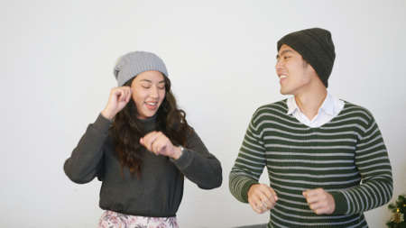 Happy Asian beautiful young family couple lifestyle husband and wife smile dancing laughing around...