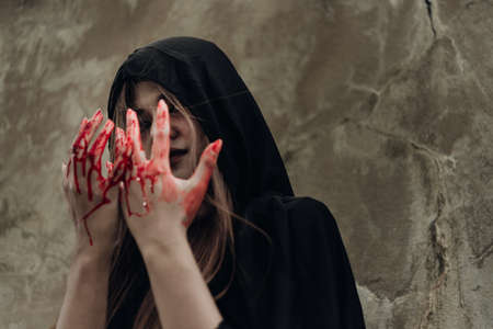 Portrait monster woman ghost and hand have red blood, halloween concept
