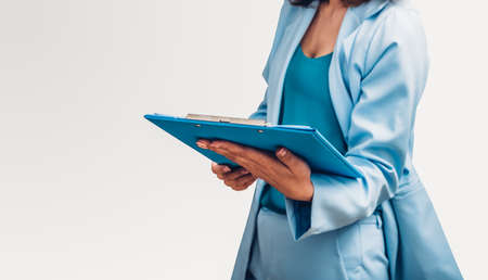 Young business woman her holding file document isolate on white backgroundの写真素材
