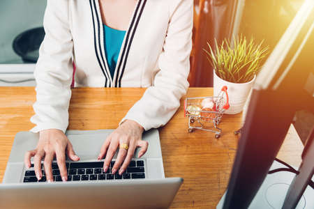 Young business woman working using laptop computer on desk officeの写真素材