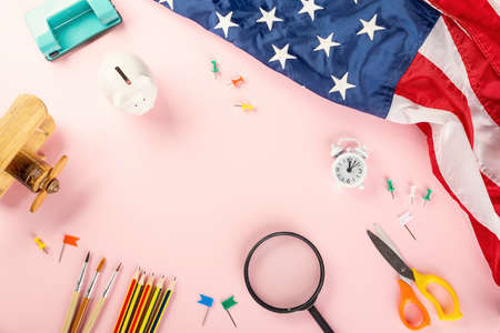 Back to school or college concept. Top view of school supplies stationery and American flag, studio...