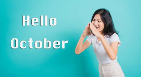 Hello October, Portrait Asian beautiful happy young woman smile white teeth wear white t-shirt...
