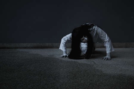 Woman ghost horror creepy her is crawling, halloween conceptの写真素材