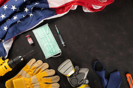 Happy Labor Day. Several engineer constructor work tools, medical face mask protective and American...